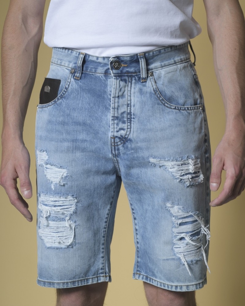 Short jean effet vieilli et empiècement en cuir John Richmond 